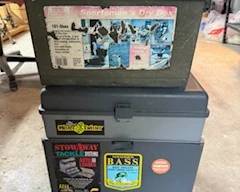 Lots of fishing gear, including these boxes, rods, reels lures and flies