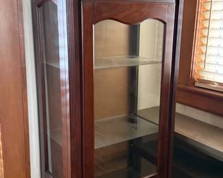 Cherry finished curio with glass shelves and light. Excellent conditon!