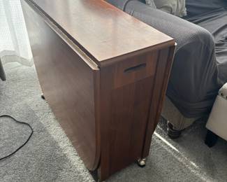 Drop leaf table with folding chairs that store inside