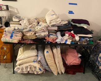 Bedding, pillows, women’s jeans and fabric .