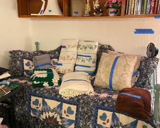 Day bed with trundle and linens.
