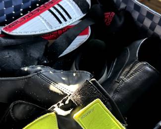 box of youth soccer shoes and shin guards