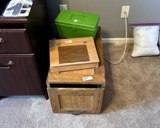 Sewing box (green), curtains on right, wooden file/type box, and lap desk