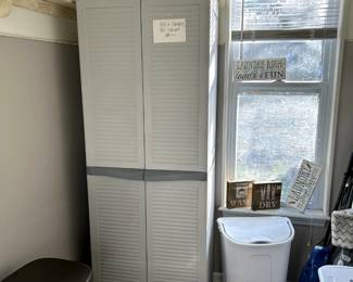 Black and Decker storage cabinet, very nice, misc hampers and trashcans, laundry room art