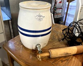 Old crock with lid, rolling pin , one of two oak tables
