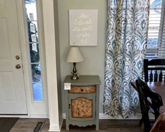 Cute table with drawer and door, lamp and picture