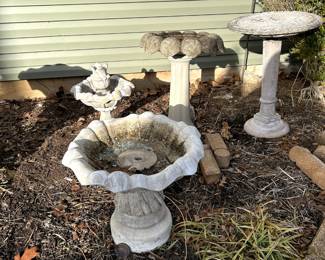4 birdbaths (far left one in plastic, other three concrete)