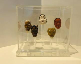 Antique Japanese Miniature Dancing Masks in clear acrylic case.