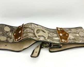 vintage Western-style cowhide belt with a silver-plated horseshoe buckle and coin decoration