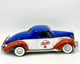 Auto World 1:18 scale diecast model of a 1937 Lincoln Zephyr Coupe in a "Pepsi Cola" livery