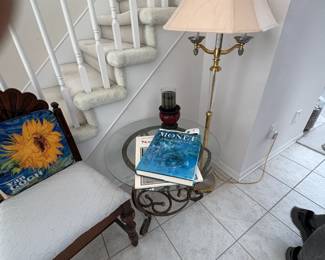 . . . glass accent table and brass standing lamp