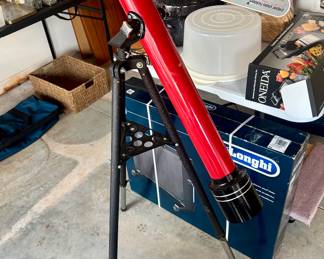 Telescope.  Study the stars or the ant crawling on the garage floor.