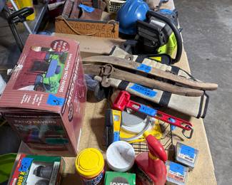 More garage stuff, chainsaw, old implements,