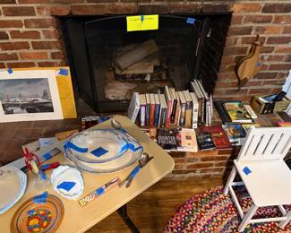 Fireplace screen, books, kids chair, old china pieces, wooden plate brought back from Czechoslovakia after WWII,
