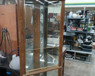 Glass shelved display corner cabinet.