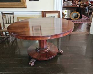 Victorian tilt top dinner table with lion feet.