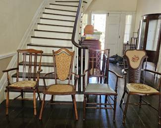 Four Arts & Craft chairs circa 1860. The one on the far right is Liberty Furniture Company.