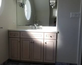 Bath vanity; mirror; sconce lights