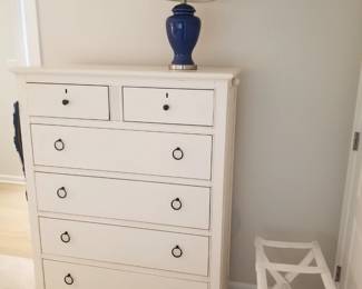 Queen bedroom suite: tall dresser; table lamp; luggage stand