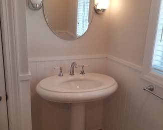 Kohler pedestal sink; Vanity mirror; sconce lights