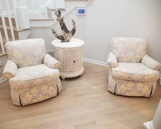 Pretty upholstered swivel chairs; drum table; anchor sculpture