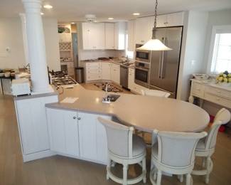 Large kitchen with island; extensive amount of cabinetry