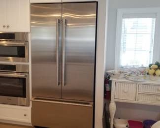 Jenn-Air model JF42NXFXDE05 refrigerator mfg. 4/2023 is 42 inches wide, a French door refrigerator with 24.17 Cu. Ft. Total Capacity, Filtered Automatic Ice Maker, Fresh Flow Air Filter, TwinFresh™ Climate Control System, Theater LED Lighting, Touch Control