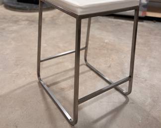 Room & Board Collins Stainless Steel Counter Stool Upholstered in Pesaro Ivory Leather. Measures 16" x 16" x 24" H. Photo 1 of 2. 