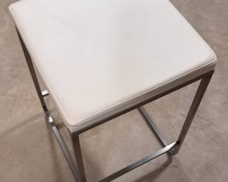 Room & Board Collins Stainless Steel Counter Stool Upholstered in Pesaro Ivory Leather. Measures 16" x 16" x 24" H. Photo 2 of 2. 