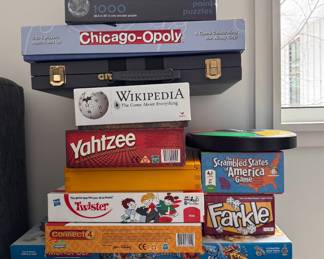 Board Games including Chicago-Opoly, Yahtzee and Fishin' Opoly. 