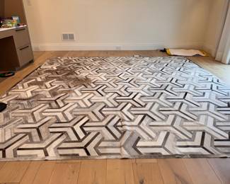 Cow Hide / Hair of Hide Patchwork Rug. Measures 10' 7" x 10' 3". Some Wear. Photo 2 of 4. 