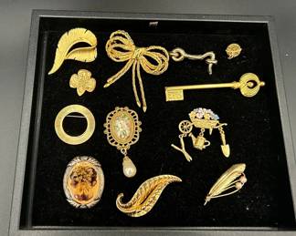 Twelve Gold Toned Broaches Featuring Pearl Feather Broach