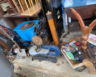 Piles of tools and project pieces. 