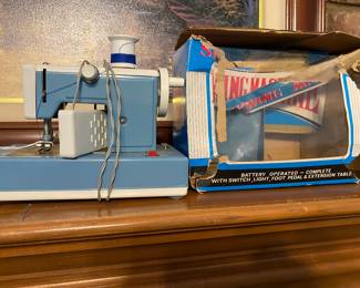 Vintage Battery Toy Sewing Machine with box. 