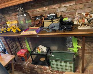 Lots of vintage toys. Toy locomotive, toy battery sewing machine, rare pink kit cat clock. Vintage tonka fork lift and scraper. Etch A Sketch in box, Tom Thumb Cash Register with Box. Several vintage 35mm cameras. 2 vintage Sears Binoculars. Signed sports Memorabilia. 