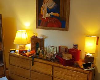 Perfumes and dresser and art and lamps oh my!