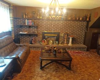 Lots of leather bottles on the mantle