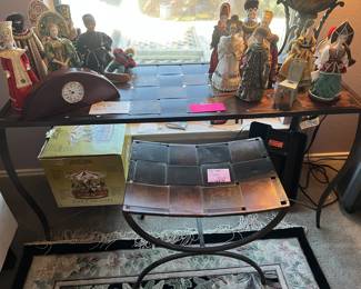 Large metal woven table and smaller matching seat. The dolls are on top are from Russia.