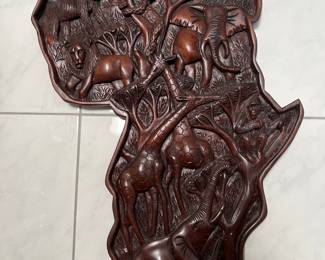 Large hand carved black of Africa with with animals all over it