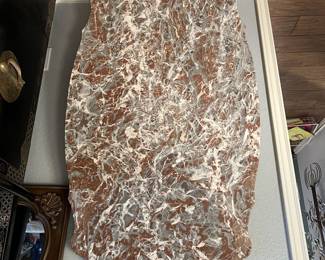 Large piece of marble for a coffee table . 
Look at the beautiful scalloped edges
