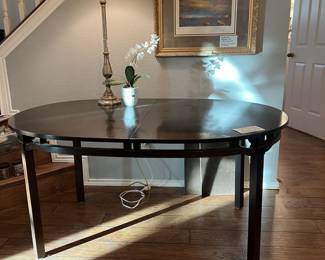 Another picture of the dining room table. This is a dark chocolate wood color and it does come with one additional leaf.