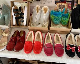 Lots of UGG footwear shoes, some new and unworn.