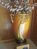 Roseville pottery, Pine Motif. Many pieces of antique and collectible pottery.