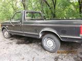 Late 80's, Ford F-150. 80,000 original miles, runs well.