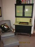 Vintage Naugehyde chair and ottoman, writing desk, vintage Thermos containers and lunch box.