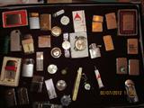 Zippo lighters, (on Right) Miscellaneous brands on left, mens wrist watches in the center, Longiness wrist watch, Timex,