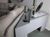 Custom made tables for behind curved sofa.