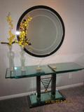 Glass top console table, contemporary table, mirror, decorations.