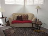 IKEA Sofa, needs new cover, area rug, lamps, table.