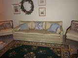 Sofa, French Provencial chairs, area rug, art work